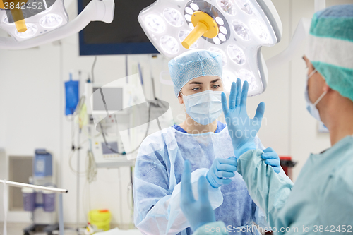 Image of surgeons in operating room at hospital