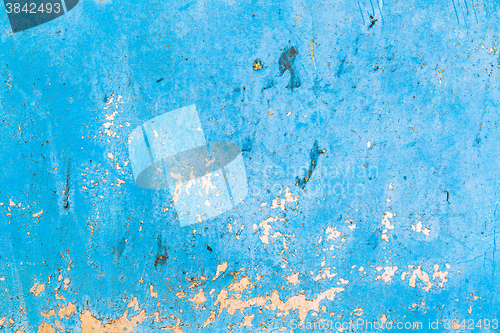 Image of Old blue cracked paint on metal background