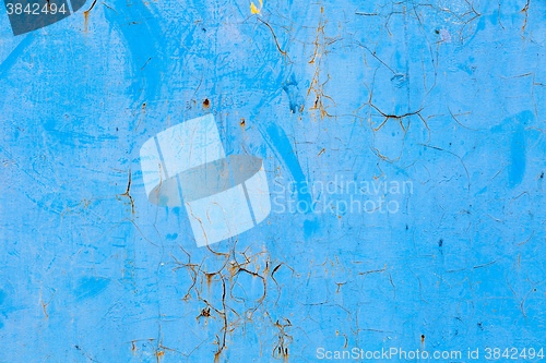 Image of Old blue cracked paint on metal background