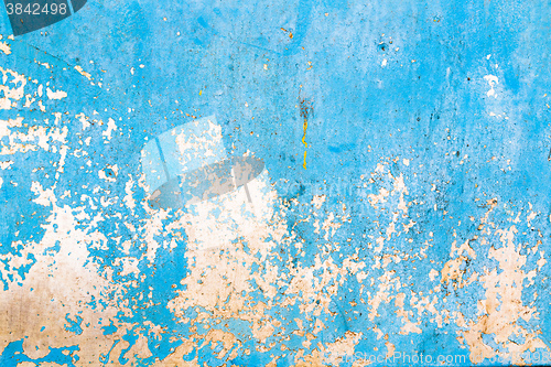 Image of Old blue cracked paint on metal background