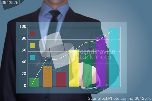 Image of Businessman Touching a Graph Indicating Growth. business concept 