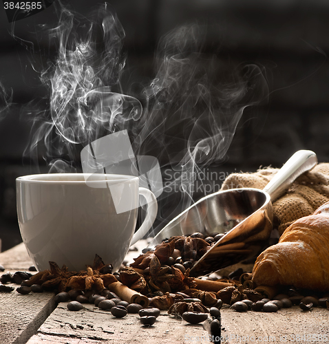 Image of Hot coffee and croissant