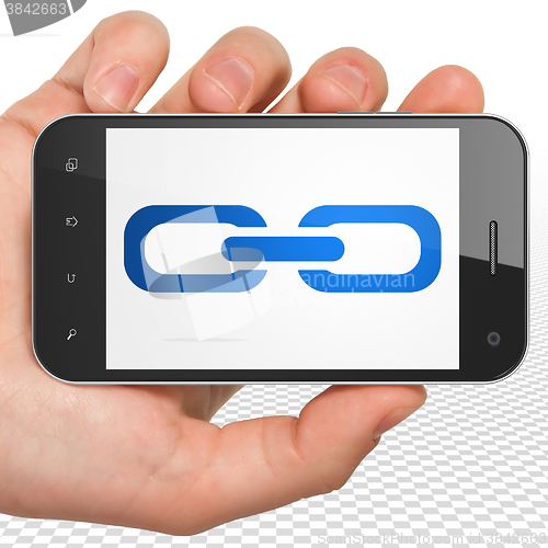 Image of Web design concept: Hand Holding Smartphone with Link on display