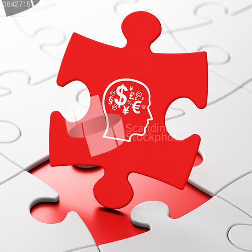 Image of Education concept: Head With Finance Symbol on puzzle background