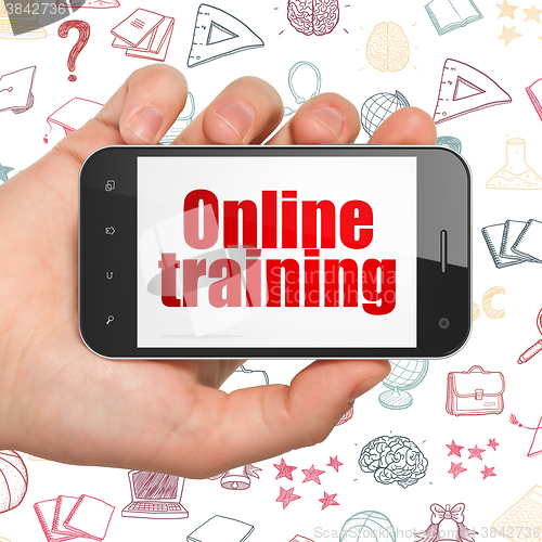Image of Learning concept: Hand Holding Smartphone with Online Training on display