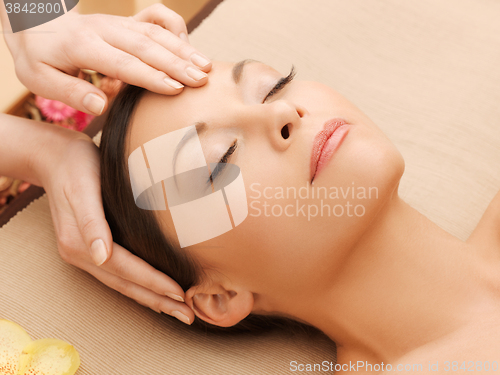 Image of beautiful woman in massage salon