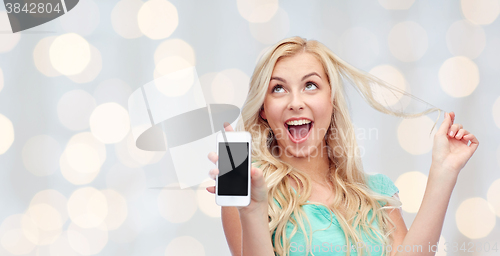 Image of happy young woman or teenage girl with smartphone