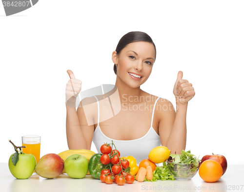 Image of happy woman with fruits and vegetables