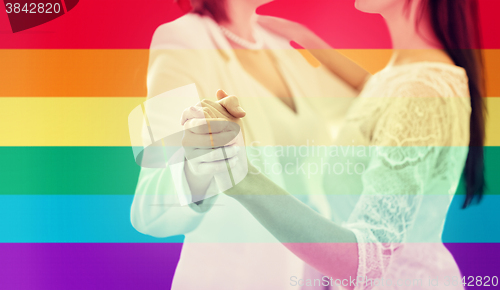 Image of close up of happy married lesbian couple dancing
