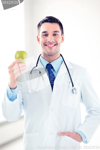 Image of male doctor with green apple