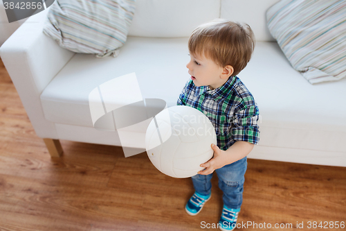 Image of happy little baby boy with ball at home