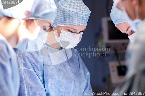 Image of group of surgeons in operating room at hospital