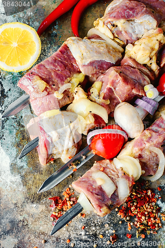 Image of raw meat on skewer