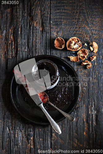 Image of The top view of fruity jam on black wooden table