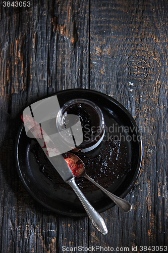 Image of The top view of fruity jam on black wooden table