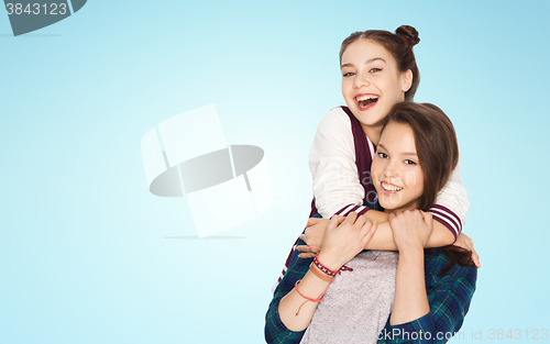 Image of happy smiling pretty teenage girls hugging
