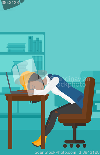 Image of Woman sleeping on workplace.