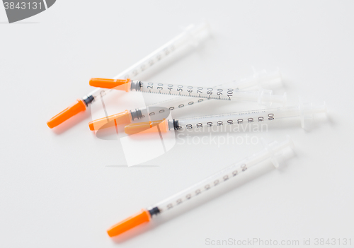 Image of close up of insulin syringes on table