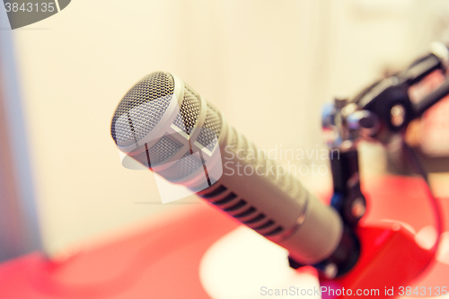 Image of microphone at recording studio or radio station