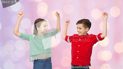 Image of happy boy and girl celebrating victory