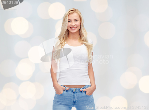 Image of happy young woman or teenage girl in white t-shirt