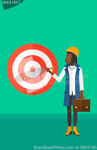 Image of Business woman with target board.