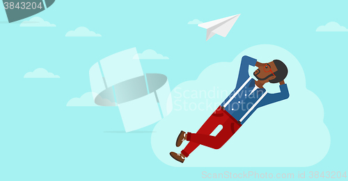 Image of Businessman relaxing on cloud.