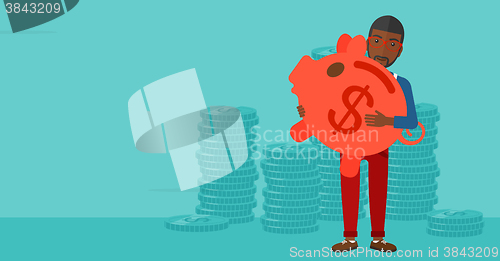 Image of Man carrying piggy bank.