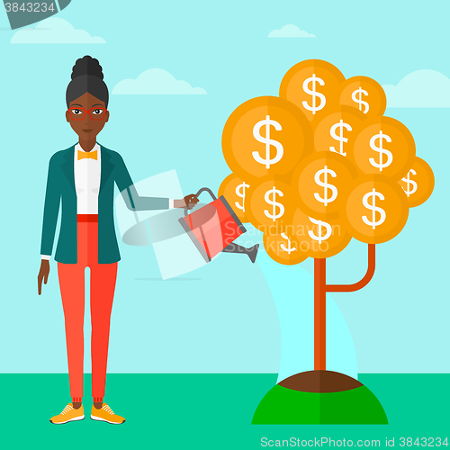 Image of Woman watering money tree.