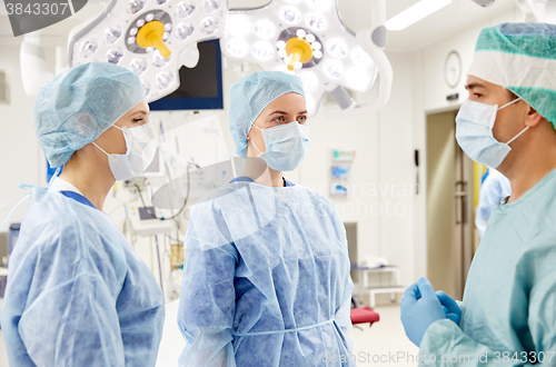 Image of group of surgeons in operating room at hospital