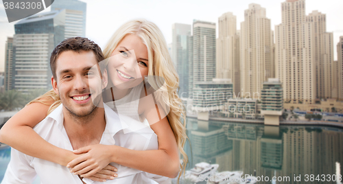 Image of happy couple having fun over dubai city background