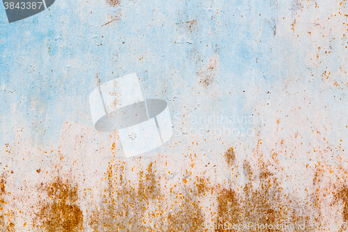 Image of Old blue cracked paint on metal background