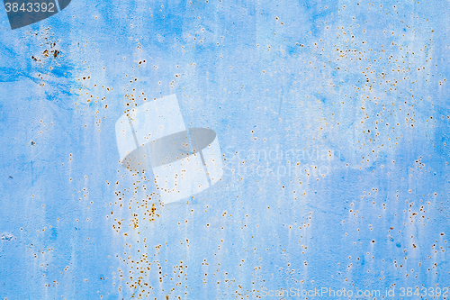 Image of Old blue cracked paint on metal background