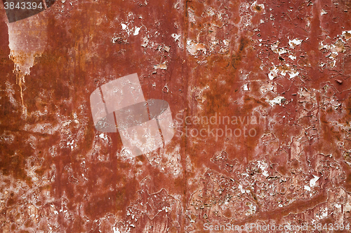 Image of Old red cracked paint on metal background