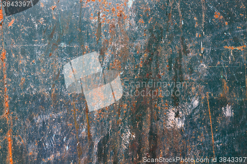 Image of Old blue cracked paint on metal background