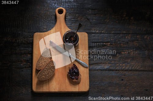 Image of The top view of fruity jam on black wooden table