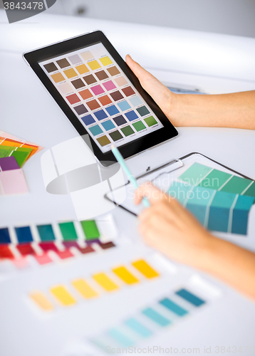 Image of woman working with color samples for selection