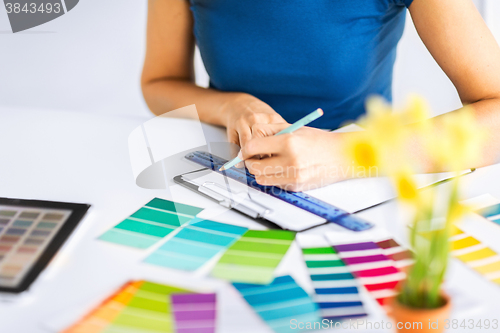 Image of woman working with color samples for selection