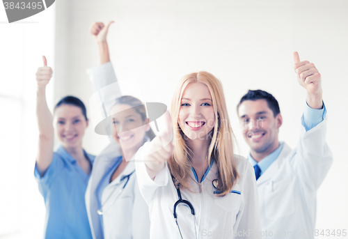 Image of group of doctors showing thumbs up