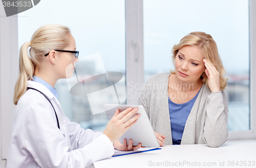 Image of doctor with tablet pc and ill woman at hospital