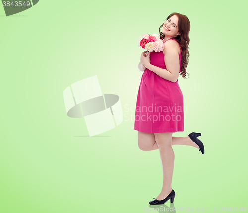 Image of happy young plus size woman with flower bunch