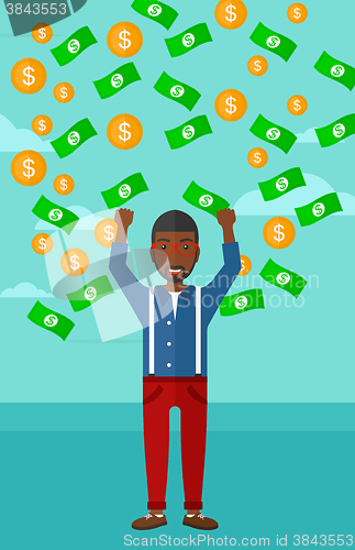Image of Happy man with  flying money. 