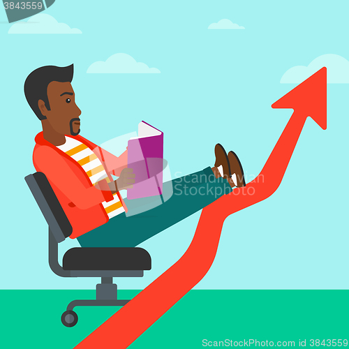 Image of Businessman reading book.
