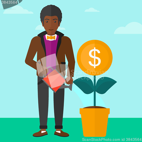 Image of Man watering money flower.