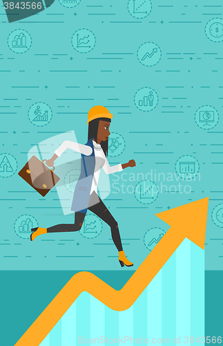 Image of Woman running on growth graph. 