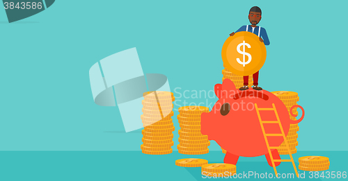 Image of Man putting coin in piggy bank.