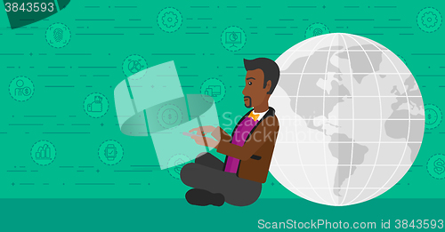 Image of Man sitting near globe.