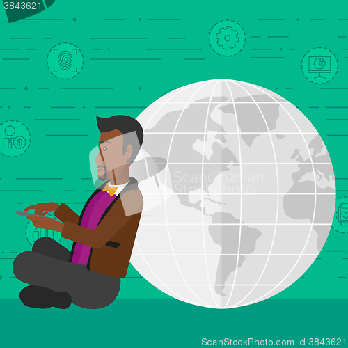 Image of Man sitting near globe.