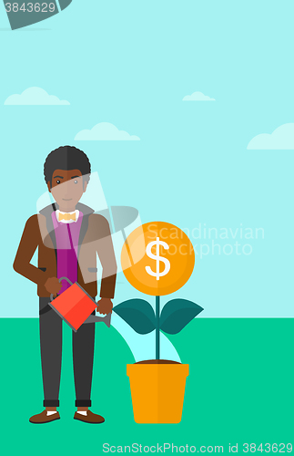 Image of Man watering money flower.