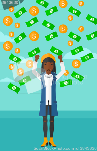 Image of Happy woman with  flying money. 